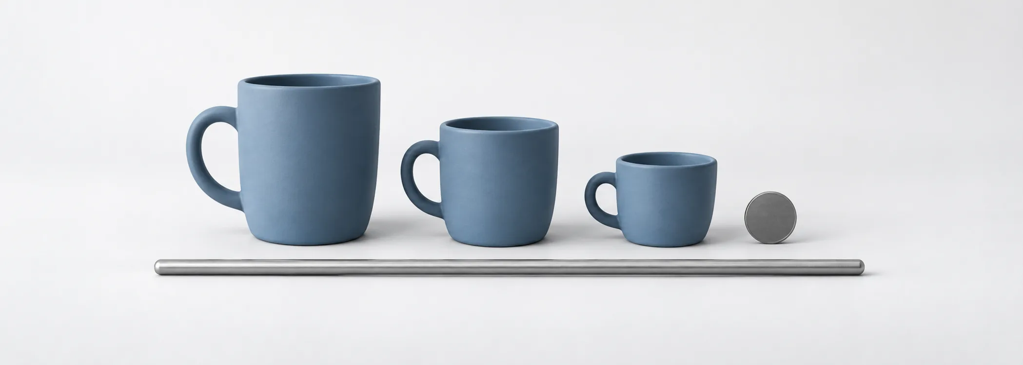 Three descending blue cups beside a graphite disc and silver measuring rod, representing three levels of profit from sales.