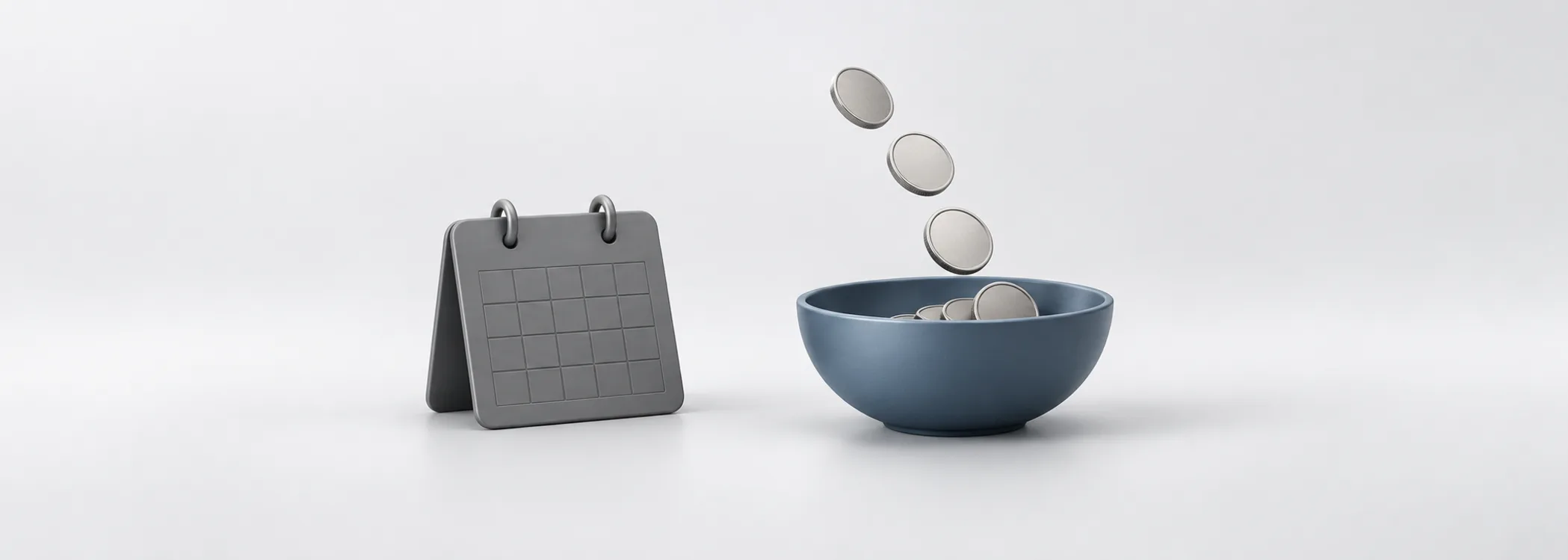 A graphite calendar beside a steel-blue bowl catching silver coins, representing a portfolio supplying regular spending.